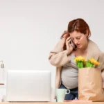 A stressed pregnant woman experiencing emotional and physical stress during pregnancy due to various lifestyle and health factors